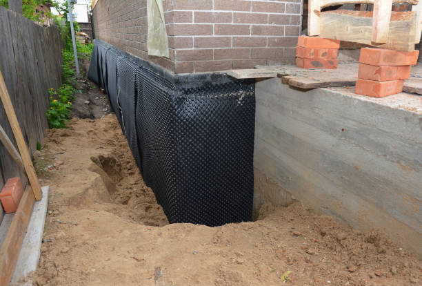 SJ Waterproofing Pros technician performing targeted Emergency Waterproofing assessment in Uniopolis, OH